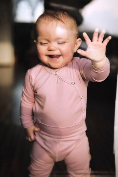 Newborn pink cotton bodysuit